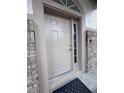 Close-up of the front door with brick columns on both sides at 2438 Winfield Dr, Kissimmee, FL 34743