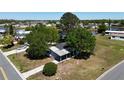 Exterior shot of a single story home, with mature landscaping on a corner lot at 2601 Salina Way, Kissimmee, FL 34758