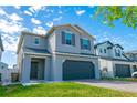 Beautiful two-story home with a two car garage, nice landscaping and inviting curb appeal at 2804 Alpine Meadow Ln, Kissimmee, FL 34744