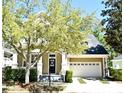 Charming two-story home with a lovely front porch and attractive landscaping in a serene neighborhood setting at 1027 Banks Rose St, Celebration, FL 34747