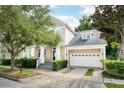 Beautiful two-story home with a well-maintained lawn and attached garage at 1027 Banks Rose St, Celebration, FL 34747