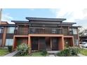 Two-story condo featuring covered balcony, private entrance and muted earth-tone color palette at 1240 Sago Palm Blvd # 1240, Kissimmee, FL 34741