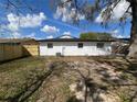 Spacious backyard with a new wooden fence providing privacy at 1749 Sorolla Ct, Orlando, FL 32811