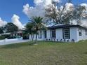 Picture of a cozy white brick home with a neatly maintained front yard at 1749 Sorolla Ct, Orlando, FL 32811