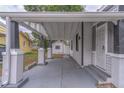 Long view under carport with columns featuring secure front door at 406 10Th St, St Cloud, FL 34769