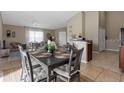 Cozy dining area featuring a dark wood table with seating for four and views to the living area at 407 Reserve Dr, Davenport, FL 33896