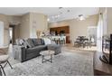 Bright and spacious living room with open layout to the kitchen and dining area at 407 Reserve Dr, Davenport, FL 33896