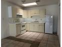 Bright kitchen with white appliances, tile floors and ample counter space at 4179 Spitfire Ave, Kissimmee, FL 34741