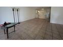Open living room featuring tile flooring and a view into the kitchen at 4179 Spitfire Ave, Kissimmee, FL 34741