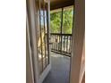 Open view from the balcony, showcasing outdoor space with wood railings and natural sunlight at 445 Fountainhead Cir # 264, Kissimmee, FL 34741