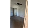Bedroom featuring carpeted floors, a ceiling fan, and a mirrored sliding closet at 445 Fountainhead Cir # 264, Kissimmee, FL 34741