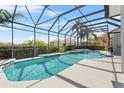 Inviting screened-in pool and spa area, perfect for relaxation and entertaining in a private outdoor setting at 478 Chelsea Ave, Davenport, FL 33837