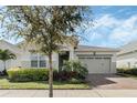 Lovely single-Gathering home with beautiful landscaping and a two-car garage, complete with a paver driveway at 5151 Twin Lakes Blvd, St Cloud, FL 34772
