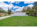 A home with a well-maintained lawn and a covered front porch at 790 Park Ln, Kissimmee, FL 34741