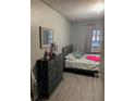 Modest bedroom featuring modern decor and neutral tones at 10538 Clarcona Ocoee Rd, Apopka, FL 32703