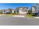 Beautifully landscaped two-story home with a brick driveway at 14321 Wabasso Loop, Winter Garden, FL 34787