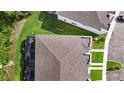 Aerial view of the community, featuring well-manicured lawns and a shared swimming pool at 17238 Blessing Dr, Clermont, FL 34714