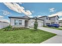 Attractive single Gathering home with a two car garage and landscaped lawn at 2039 Derwent Dr, Davenport, FL 33896