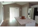 Kitchen with stainless appliances, an island, and plenty of natural light at 214 Kay St, Auburndale, FL 33823