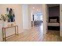 The modern home has an inviting entrance leading to an open concept living space with neutral finishes and decor at 2166 Derwent Dr, Davenport, FL 33896