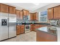 Well-equipped kitchen with stainless steel appliances, granite counters, and ample cabinet space at 3471 Julius Estates Blvd, Winter Haven, FL 33881