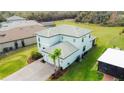 Aerial view of the home showcasing its tile roof, backyard space, and proximity to neighboring properties at 3920 Reed Grass Pl, Kissimmee, FL 34746