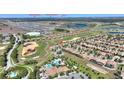 High-angle aerial view showcasing community amenities and proximity to major attractions at 1335 Palmetto Dunes St, Davenport, FL 33836