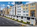 Apartment building exterior featuring multiple stories, balconies, and well-maintained landscaping at 151 E Washington St # 327, Orlando, FL 32801