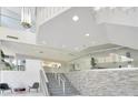 Modern lobby with stylish staircase, glass walls, and contemporary design elements at 151 E Washington St # 327, Orlando, FL 32801