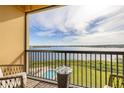 Relaxing balcony with lake and pool views, perfect for outdoor seating at 16300 County Road 455 # 612, Montverde, FL 34756