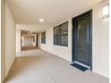 Well-lit hallway leading to unit 612, featuring neutral colors and clean finishes at 16300 County Road 455 # 612, Montverde, FL 34756
