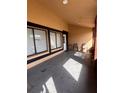 Covered porch with seating area and neutral walls at 20 S Flag Ct, Kissimmee, FL 34759
