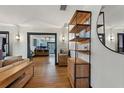 Open-concept living room with hardwood floors and a view into the kitchen area at 204 E Harvard St, Orlando, FL 32804