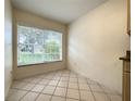 Bright breakfast nook featuring tile flooring and a large window at 2160 Addison Ave, Clermont, FL 34711