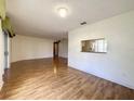 Spacious living room with hardwood floors and a view to the Kitchen at 2160 Addison Ave, Clermont, FL 34711