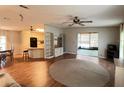 Open floor plan showcases the living room, kitchen, and adjacent sunroom at 222 Palmer Park Ln, Davenport, FL 33897