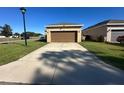 Detached garage with a long driveway and plenty of parking space at 3100 Rocky River Rd, Kissimmee, FL 34746
