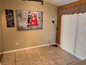 Inviting dining area with tile flooring and a large art piece at 326 Hanging Moss Rd, Davenport, FL 33837