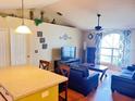 Cozy living room featuring hardwood floors, vaulted ceilings and neutral walls at 326 Hanging Moss Rd, Davenport, FL 33837