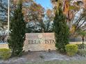 Bella Vista community sign with decorative stone and landscaping at 401 Fountainhead Cir # 155, Kissimmee, FL 34741