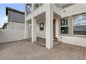 The front porch with brick paving and a grand entrance creates curb appeal at 7059 Nemours Pkwy, Orlando, FL 32827