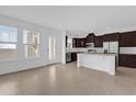 Bright and spacious kitchen featuring stainless steel appliances and a center island at 7059 Nemours Pkwy, Orlando, FL 32827