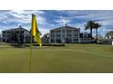 Scenic view of the golf course with lush green fairways and manicured landscaping on a clear, sunny day at 7673 Heritage Crossing Way # 301, Reunion, FL 34747