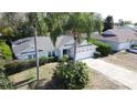 Charming single-story home with well-kept landscaping and a two-car garage in a suburban neighborhood at 129 Pine Lake View Dr, Davenport, FL 33837