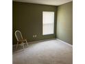 Inviting bedroom with neutral walls, plush carpeting, and a window with blinds at 132 Santana Pl, Davenport, FL 33897