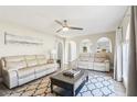 Inviting living room featuring neutral tones, arched accents, and comfortable seating at 16035 Wilkinson Dr, Clermont, FL 34714
