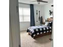 Bright bedroom with a cozy bed, natural light, and charming decor at 1767 Smarts Rule St, Kissimmee, FL 34744