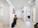 Bright entryway featuring tile flooring and access to multiple rooms at 202 Zircon Rd, Kissimmee, FL 34758