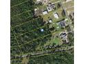 An aerial view of the land plot shows the property lines in an undeveloped area at 2086 Blackfoot Trl, St Cloud, FL 34771