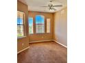 Cozy bedroom featuring a ceiling fan and big windows at 619 Terrace Ridge Cir # 619, Davenport, FL 33896